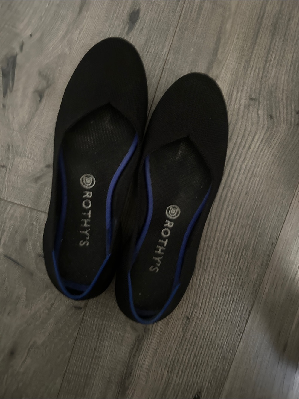 Rothy's Black Slip-On Flats with Blue Trim